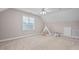 Bedroom with neutral walls, carpet, and large window and play teepee at 128 Low Country Ct, Morrisville, NC 27560