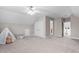 Large bonus room with neutral walls, soft carpet, and a fun teepee for the  at 128 Low Country Ct, Morrisville, NC 27560