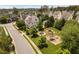 Aerial view of a community playground and park with swings and play structures at 128 Low Country Ct, Morrisville, NC 27560