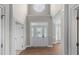 Bright foyer with high ceilings, hardwood floors, and decorative glass front door at 128 Low Country Ct, Morrisville, NC 27560