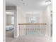 Second story hallway with decorative railing at 128 Low Country Ct, Morrisville, NC 27560