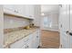 Kitchen cabinets and granite counters adjacent to light filled dining area at 128 Low Country Ct, Morrisville, NC 27560