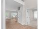 Spacious living area with hardwood floors, stairs, and an open doorway at 128 Low Country Ct, Morrisville, NC 27560