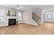 Living room featuring fireplace, staircase and entry foyer at 128 Low Country Ct, Morrisville, NC 27560