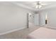 Spacious main bedroom with a tray ceiling, soft carpet and two entrance doors at 128 Low Country Ct, Morrisville, NC 27560