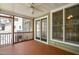 Inviting screened porch with wooden floors, ceiling fan, and backyard views at 128 Low Country Ct, Morrisville, NC 27560