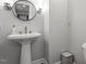 A bright bathroom with a pedestal sink at 130 E Longview St # Apt S, Chapel Hill, NC 27516