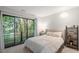 Calming bedroom featuring sliding glass doors to the outside and neutral walls at 130 E Longview St # Apt S, Chapel Hill, NC 27516