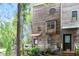 Exterior shot of home with wood paneling and lush green trees at 130 E Longview St # Apt S, Chapel Hill, NC 27516