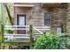 Inviting front entrance with wood siding, a covered porch, and a decorative flower pot at 130 E Longview St # Apt S, Chapel Hill, NC 27516