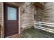 Charming front entrance featuring a wooden door, weathered wood siding, and a covered porch at 130 E Longview St # Apt S, Chapel Hill, NC 27516