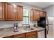 Modern kitchen with stainless steel appliances, granite counters, and wood cabinetry at 130 E Longview St # Apt S, Chapel Hill, NC 27516