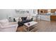 Open concept living space with hardwood floors, neutral walls, and comfortable furniture at 130 E Longview St # Apt S, Chapel Hill, NC 27516
