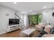 Inviting living room featuring sliding glass doors to the outside, neutral walls, and hardwood flooring at 130 E Longview St # Apt S, Chapel Hill, NC 27516