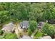 Aerial view of the home with lush surroundings, beautifully landscaped yards and neighboring properties at 1312 Stonemoor Ct, Raleigh, NC 27606