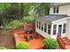 Relaxing backyard deck with a grill and seating, perfect for outdoor entertaining at 1312 Stonemoor Ct, Raleigh, NC 27606
