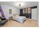 Bedroom showcasing a black accent wall, a comfortable bed, and ample natural light at 1312 Stonemoor Ct, Raleigh, NC 27606