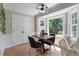 Cozy breakfast nook features large windows with natural light and a view of the backyard at 1312 Stonemoor Ct, Raleigh, NC 27606