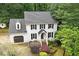 Charming two-story home with a brick facade, black shutters, and well-manicured landscaping at 1312 Stonemoor Ct, Raleigh, NC 27606