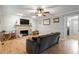 Inviting living room with fireplace, hardwood floors, neutral paint, and stylish decor at 1312 Stonemoor Ct, Raleigh, NC 27606