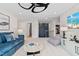 Inviting bonus room featuring a large sectional, bean bag chair, and a view into an upstairs hall at 147 Sugar Pine Drive, Franklinton, NC 27525