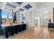 Elegant dining room featuring modern lighting, stylish decor, and a view into the foyer and beyond at 147 Sugar Pine Drive, Franklinton, NC 27525