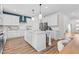 Spacious kitchen with a center island, modern appliances, and ample counter space for cooking and gatherings at 147 Sugar Pine Drive, Franklinton, NC 27525