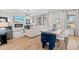 Open-concept living space with a fireplace, large windows, and stylish furnishings for a comfortable atmosphere at 147 Sugar Pine Drive, Franklinton, NC 27525