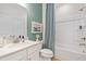 Inviting bathroom with a modern vanity, stylish shower curtain, and a clean, bright aesthetic at 148 Sugar Pine Drive, Franklinton, NC 27525
