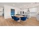 Kitchen and dining area with modern finishes, stainless appliances, and hardwood flooring at 148 Sugar Pine Drive, Franklinton, NC 27525