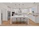 Bright, open kitchen features a large island with seating and stainless steel appliances at 148 Sugar Pine Drive, Franklinton, NC 27525