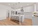 Well-appointed kitchen featuring an island with seating and stainless steel appliances at 148 Sugar Pine Drive, Franklinton, NC 27525