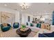Open-concept living area with comfortable seating, stylish decor, and hardwood floors at 148 Sugar Pine Drive, Franklinton, NC 27525