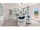 Bright home office with white desk, comfortable seating, stylish decor, and ample natural light, perfect for productivity at 148 Sugar Pine Drive, Franklinton, NC 27525