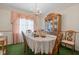 Elegant dining room with chandelier and beautiful china cabinet at 1517 Hodges Chapel Rd, Benson, NC 27504