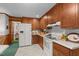 A well-equipped kitchen with white appliances and lots of cabinet space at 1517 Hodges Chapel Rd, Benson, NC 27504