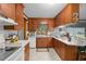 Charming kitchen features wooden cabinetry and tile flooring at 1517 Hodges Chapel Rd, Benson, NC 27504