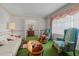 Spacious living room showcasing light walls, green carpet, and comfortable seating arrangement at 1517 Hodges Chapel Rd, Benson, NC 27504