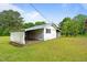 Exterior shot of outbuilding with green lawn at 1517 Hodges Chapel Rd, Benson, NC 27504