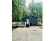 Back exterior features concrete patio and deck at 1634 Hurdle Mills Rd, Roxboro, NC 27574