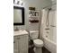 This bathroom features a shower, bathtub, and stylish white vanity at 1634 Hurdle Mills Rd, Roxboro, NC 27574