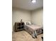 A simple bedroom shows off a comfortable bed with dresser and overhead lighting at 1634 Hurdle Mills Rd, Roxboro, NC 27574