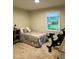 Bedroom featuring exercise equipment and a window with natural light at 1634 Hurdle Mills Rd, Roxboro, NC 27574