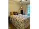 Bedroom features a patterned bedspread, neutral colors, and natural light at 1634 Hurdle Mills Rd, Roxboro, NC 27574