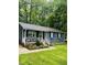 Charming front exterior of the home, featuring a manicured lawn and well-maintained landscaping at 1634 Hurdle Mills Rd, Roxboro, NC 27574
