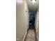 A long hallway leads into multiple rooms within the home with modern flooring and paint at 1634 Hurdle Mills Rd, Roxboro, NC 27574