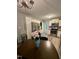 Modern kitchen with stainless appliances, white cabinets, and a dining area at 1634 Hurdle Mills Rd, Roxboro, NC 27574