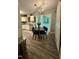 Cozy kitchen with white cabinetry, modern appliances, and an adjacent dining space at 1634 Hurdle Mills Rd, Roxboro, NC 27574