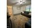 Inviting living room featuring a cozy gray sofa and decorative rug at 1634 Hurdle Mills Rd, Roxboro, NC 27574