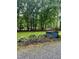 Landscaped yard with mature hostas and outbuilding at 1634 Hurdle Mills Rd, Roxboro, NC 27574